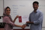 Evaluation Contest Chair presents 3rd place certificate for the Toastmasters evaluation contest